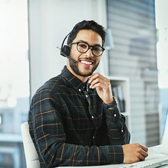 Customer service representative. Friendly customer service man with headset.