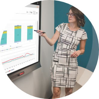 Woman presenting Payworks analytics in a big screen.