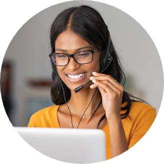 Person with a laptop in their lap looking at a piece of Payworks support material.